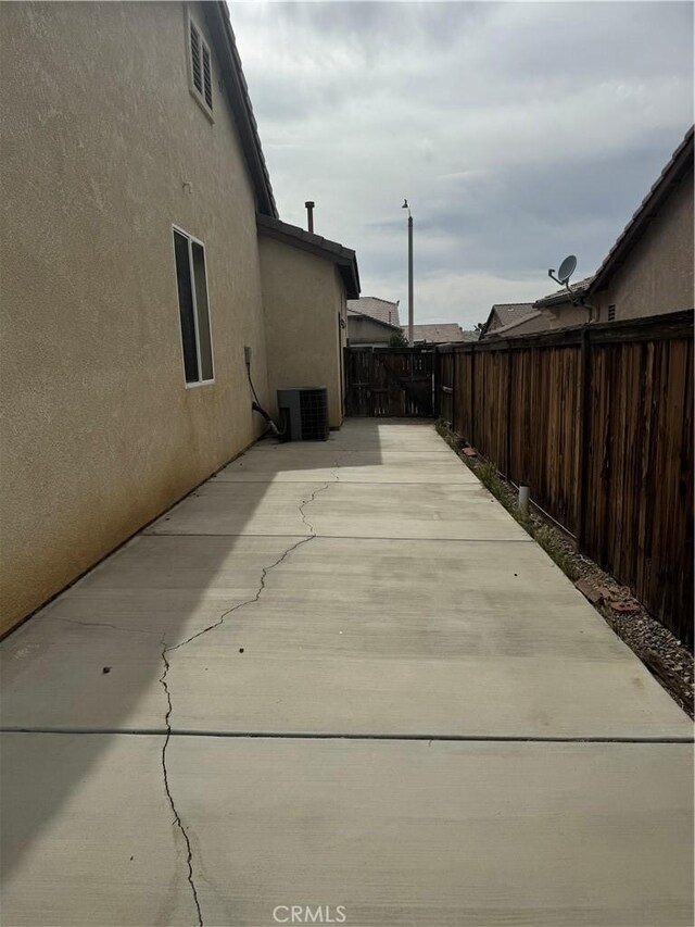 14543 Handsdale St, Adelanto, CA 92301 - fenced backyard with central air condition unit and a patio area