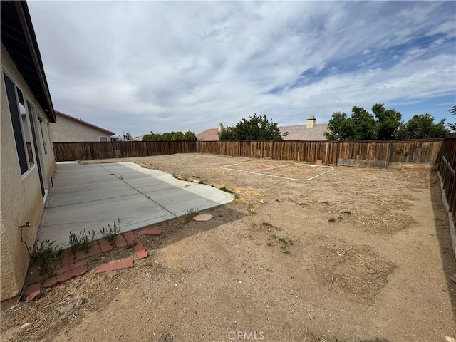 14543 Handsdale St, Adelanto, CA 92301 - fenced backyard featuring a patio area