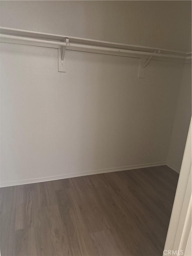 14543 Handsdale St, Adelanto, CA 92301 - walk in closet featuring dark wood-type flooring