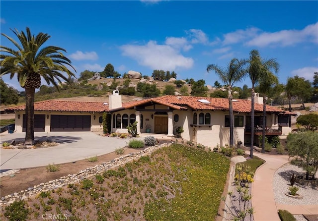 28306 Crescent Hill Way, Escondido, CA 92026 - mediterranean / spanish-style house with a chimney, stucco siding, a garage, and driveway