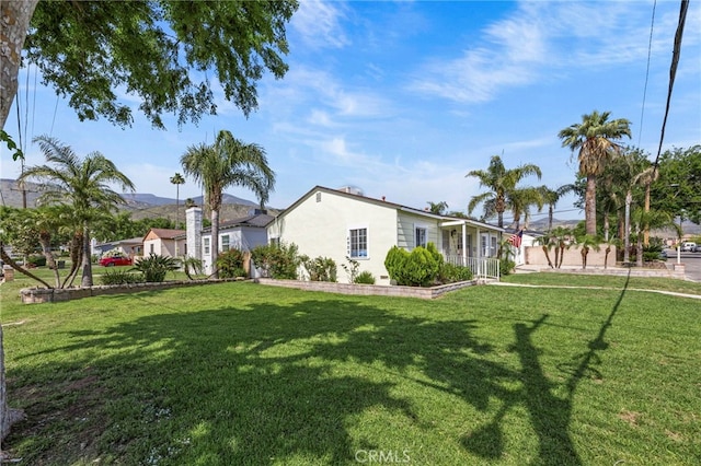 4909 Sepulveda Ave, San Bernardino, CA 92404 - view of green lawn with a mountain view