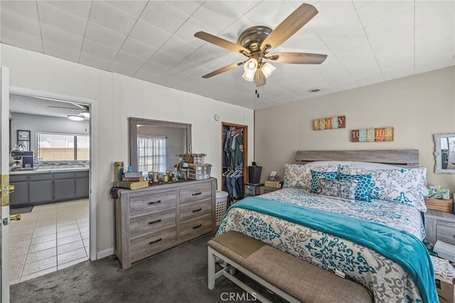 4909 Sepulveda Ave, San Bernardino, CA 92404 - bedroom featuring carpet floors, a closet, a walk in closet, and ceiling fan
