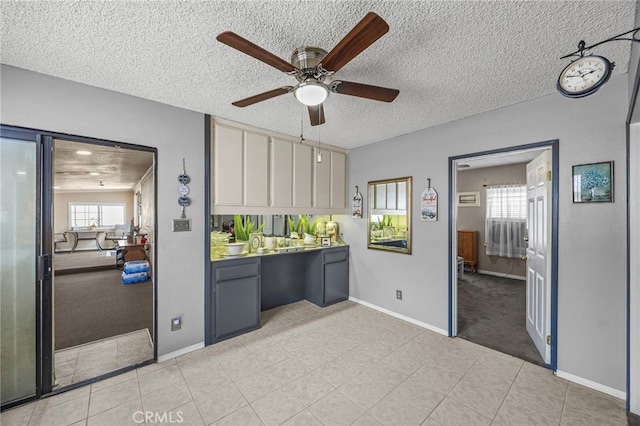 4909 Sepulveda Ave, San Bernardino, CA 92404 - kitchen with a ceiling fan, a textured ceiling, and baseboards