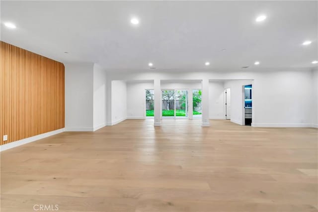 4637 Nagle Ave, Sherman Oaks, CA 91423 - spare room with recessed lighting, baseboards, light wood-style floors, and wood walls