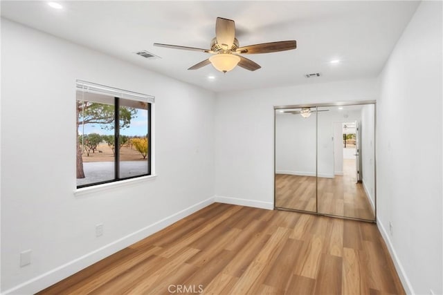 14040 Oden Dr, Apple Valley, CA 92307 - unfurnished bedroom with light wood finished floors, baseboards, a closet, recessed lighting, and a ceiling fan