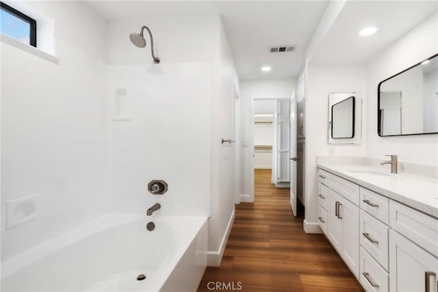 14040 Oden Dr, Apple Valley, CA 92307 - bathroom with vanity, wood finished floors, recessed lighting, shower / bath combination, and baseboards