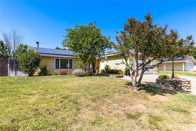 2 Comstock Rd, Chico, CA 95928 - view of front of home featuring solar panels, a front yard, concrete driveway, and a garage