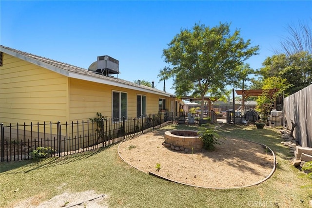 2 Comstock Rd, Chico, CA 95928 - fenced backyard featuring a fire pit and cooling unit