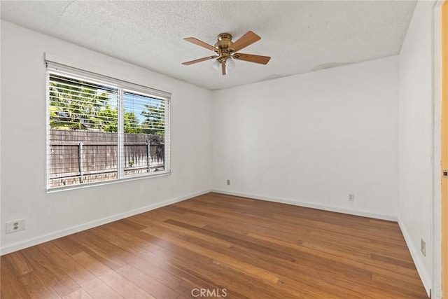 2 Comstock Rd, Chico, CA 95928 - empty room with a ceiling fan, wood finished floors, a textured ceiling, and baseboards