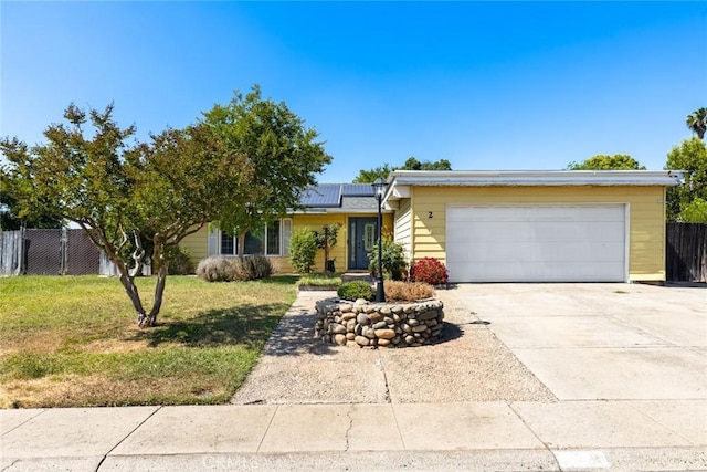 2 Comstock Rd, Chico, CA 95928 - view of front of home with solar panels, driveway, and a garage
