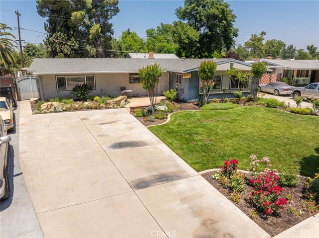 7191 Nixon Dr, Riverside, CA 92504 - ranch-style home featuring a gate and a front yard