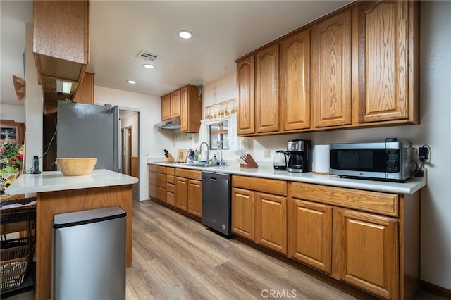 7191 Nixon Dr, Riverside, CA 92504 - kitchen with appliances with stainless steel finishes, a sink, brown cabinetry, and recessed lighting