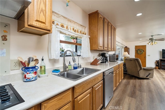 7191 Nixon Dr, Riverside, CA 92504 - kitchen featuring dishwasher, a sink, ventilation hood, black electric stovetop, and wood finished floors