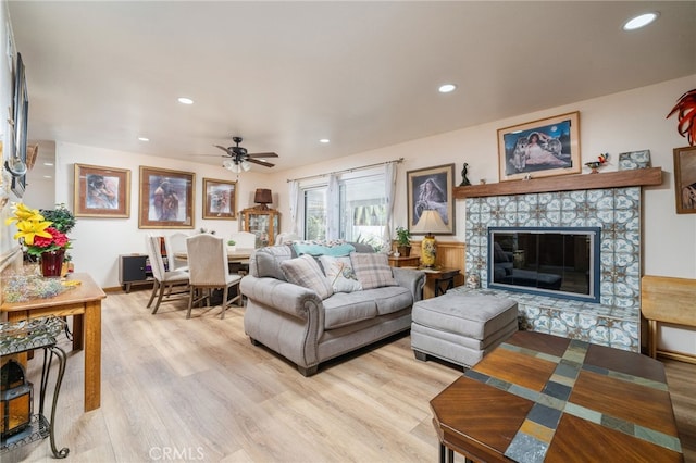 7191 Nixon Dr, Riverside, CA 92504 - living area featuring light wood finished floors, recessed lighting, a ceiling fan, and a tiled fireplace