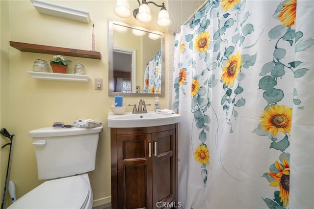 7191 Nixon Dr, Riverside, CA 92504 - full bathroom with vanity, toilet, and a shower with shower curtain