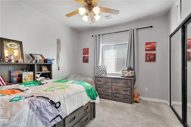 26822 Corona Dr, Helendale, CA 92342 - bedroom featuring light carpet, a ceiling fan, a closet, and baseboards