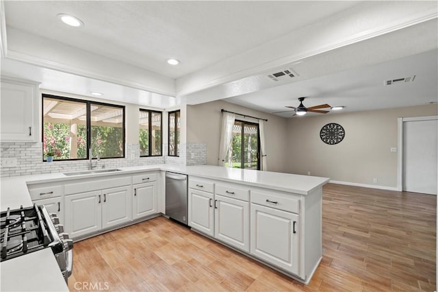 31681 Indian Oak Rd, Acton, CA 93510 - kitchen with appliances with stainless steel finishes, a sink, a peninsula, backsplash, and light countertops