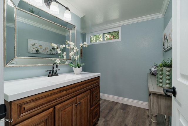 12983 Camden Ct, Moorpark, CA 93021 - bathroom featuring vanity, ornamental molding, wood finished floors, and baseboards
