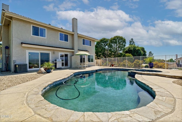 12983 Camden Ct, Moorpark, CA 93021 - view of swimming pool featuring a patio area, a fenced backyard, central AC unit, grilling area, and a pool with connected hot tub