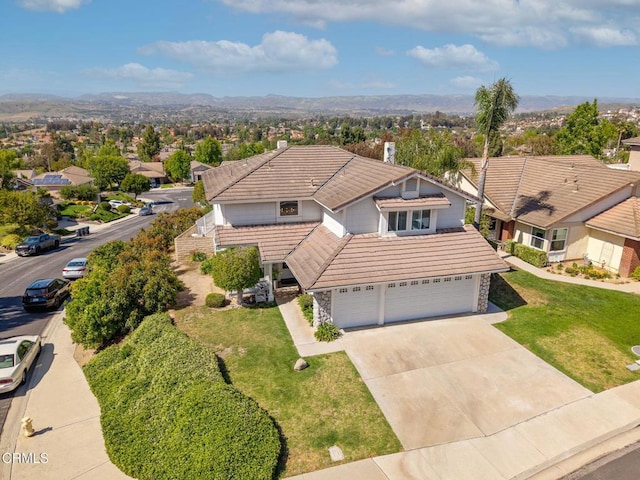 12983 Camden Ct, Moorpark, CA 93021 - traditional-style home with a tiled roof, an attached garage, stone siding, and driveway