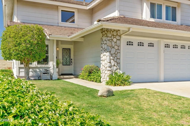12983 Camden Ct, Moorpark, CA 93021 - doorway to property with concrete driveway, a garage, a yard, a tile roof, and stone siding