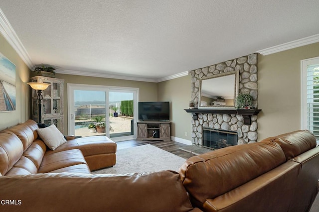 12983 Camden Ct, Moorpark, CA 93021 - living room featuring ornamental molding, a fireplace, wood finished floors, a textured ceiling, and baseboards