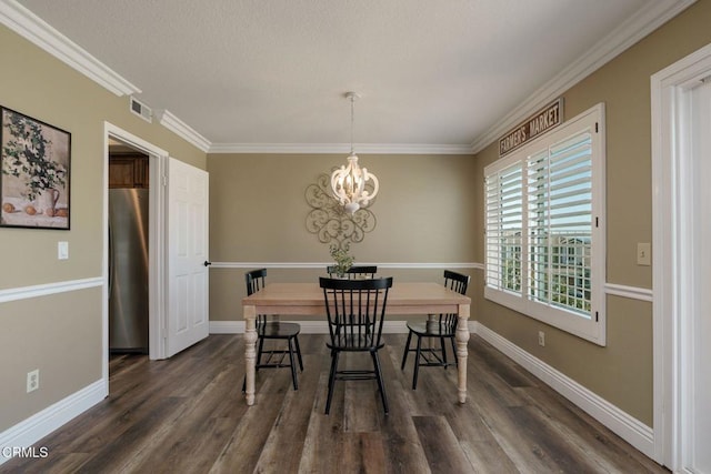 12983 Camden Ct, Moorpark, CA 93021 - dining area with a chandelier, dark wood-style flooring, crown molding, and baseboards
