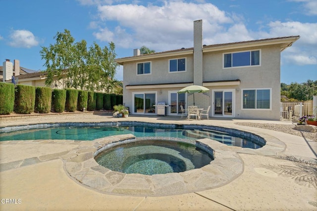 12983 Camden Ct, Moorpark, CA 93021 - view of swimming pool with a grill, a fenced backyard, a patio area, and a pool with connected hot tub