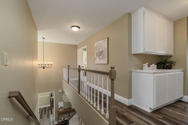 12983 Camden Ct, Moorpark, CA 93021 - staircase with wood finished floors, baseboards, and a chandelier