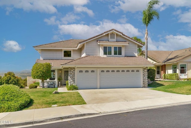 12983 Camden Ct, Moorpark, CA 93021 - traditional-style house featuring a tile roof, an attached garage, a front yard, concrete driveway, and stone siding