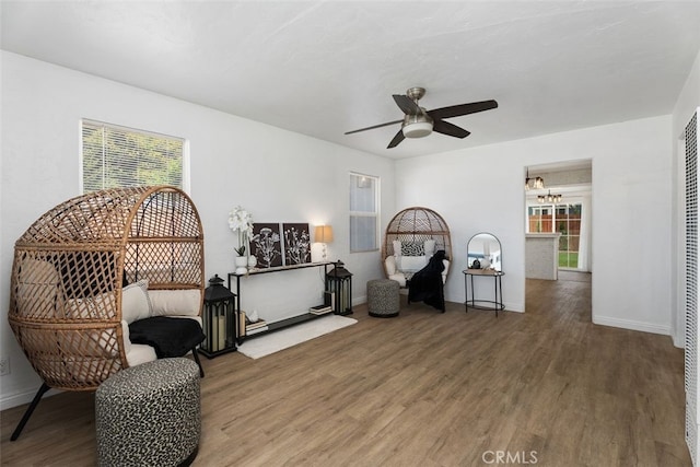 217 N Mcclay St, Santa Ana, CA 92701 - living area featuring wood finished floors, plenty of natural light, and ceiling fan