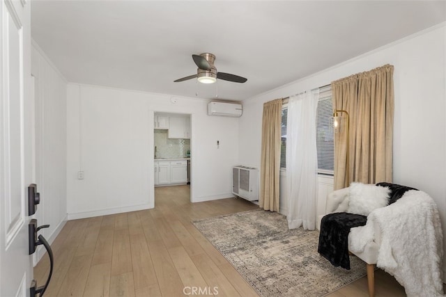 217 N Mcclay St, Santa Ana, CA 92701 - living area with a wall unit AC, ceiling fan, light wood-style floors, heating unit, and baseboards