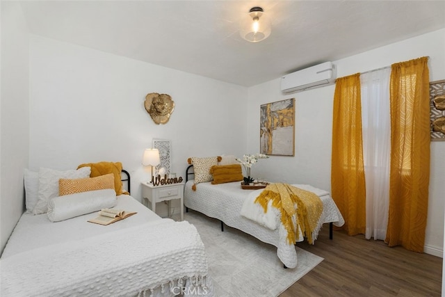 217 N Mcclay St, Santa Ana, CA 92701 - bedroom with a wall mounted air conditioner and wood finished floors