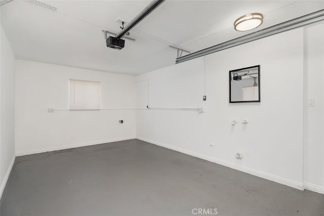 217 N Mcclay St, Santa Ana, CA 92701 - garage featuring a garage door opener and baseboards