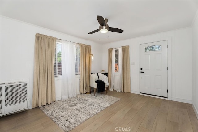 217 N Mcclay St, Santa Ana, CA 92701 - foyer entrance featuring wood finished floors, a ceiling fan, ornamental molding, and heating unit