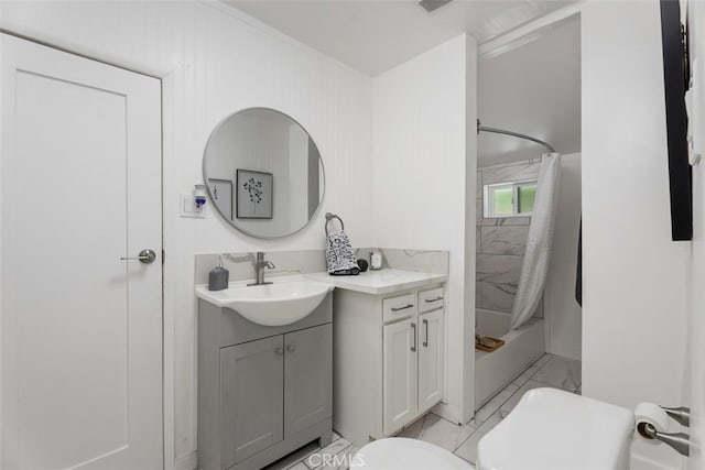 217 N Mcclay St, Santa Ana, CA 92701 - bathroom with toilet, vanity, marble look tiles, and shower / bath combo