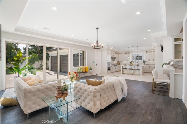 5305 Glickman Ave, Temple City, CA 91780 - living room featuring dark wood-style floors, a chandelier, recessed lighting, and crown molding