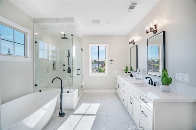 5305 Glickman Ave, Temple City, CA 91780 - bathroom featuring a marble finish shower, marble finish flooring, a freestanding tub, double vanity, and baseboards