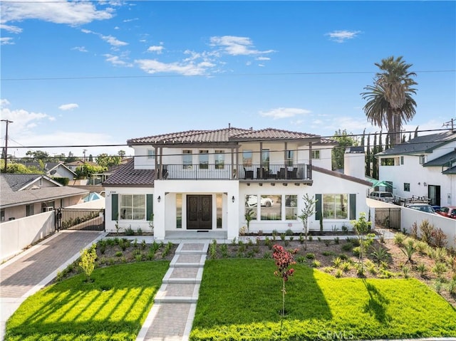 5305 Glickman Ave, Temple City, CA 91780 - view of front of property featuring a balcony, stucco siding, a residential view, driveway, and a tiled roof