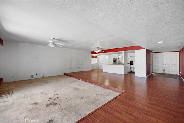 5331 Vallecito Ave, Westminster, CA 92683 - unfurnished living room featuring a ceiling fan, a textured ceiling, and dark wood-style flooring