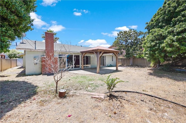 5331 Vallecito Ave, Westminster, CA 92683 - rear view of house with a patio, a fenced backyard, a gazebo, and a chimney