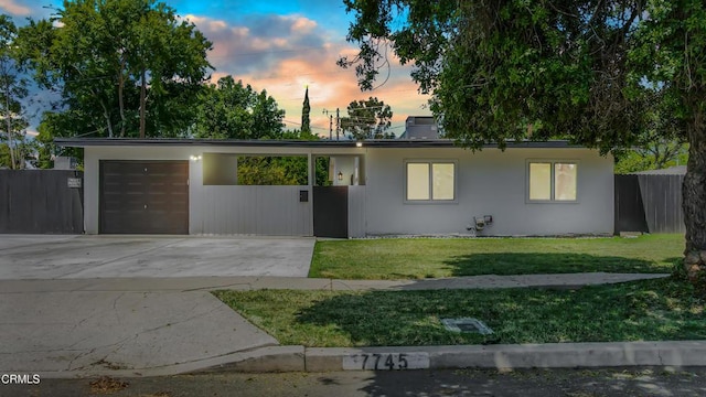 7745 Geyser Ave, Reseda, CA 91335 - view of front of house featuring concrete driveway, a garage, and stucco siding