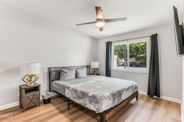 7745 Geyser Ave, Reseda, CA 91335 - bedroom featuring light wood finished floors, baseboards, and ceiling fan