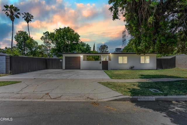 7745 Geyser Ave, Reseda, CA 91335 - view of front of property featuring concrete driveway, an attached garage, and stucco siding