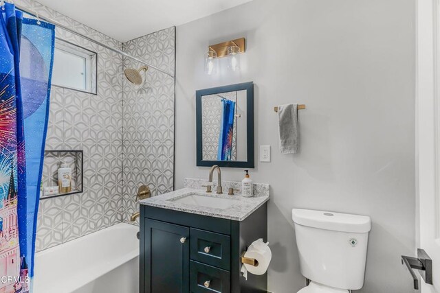 7745 Geyser Ave, Reseda, CA 91335 - bathroom featuring vanity, shower / tub combo with curtain, and toilet