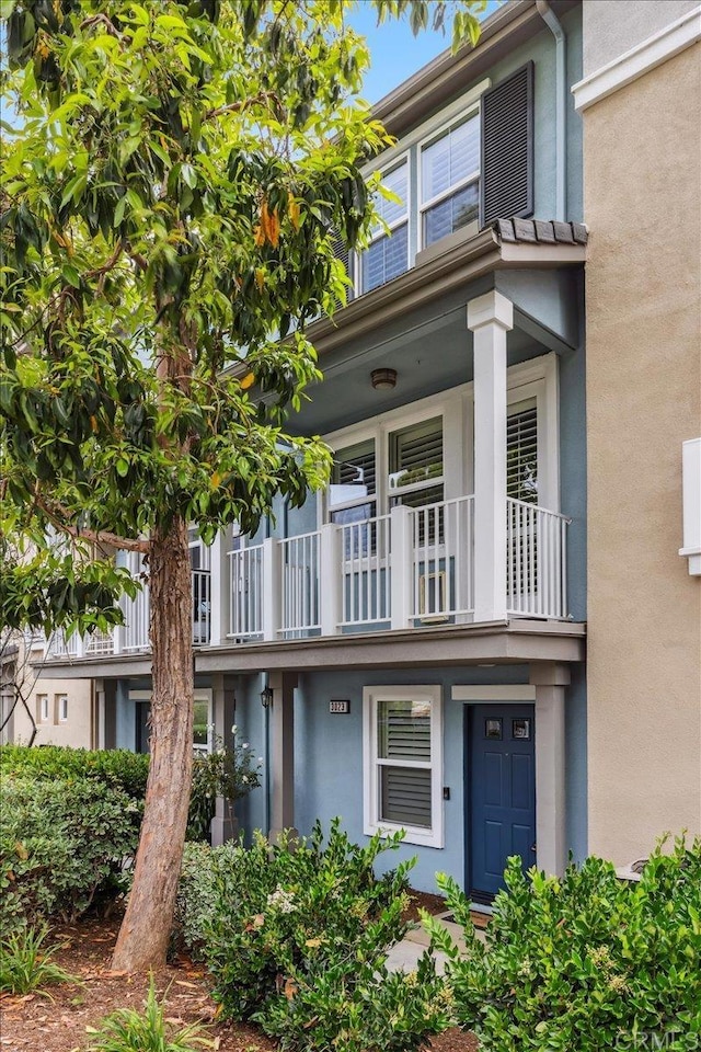 3023 Pacific Palm Way, San Diego, CA 92117 - view of property with a balcony and stucco siding