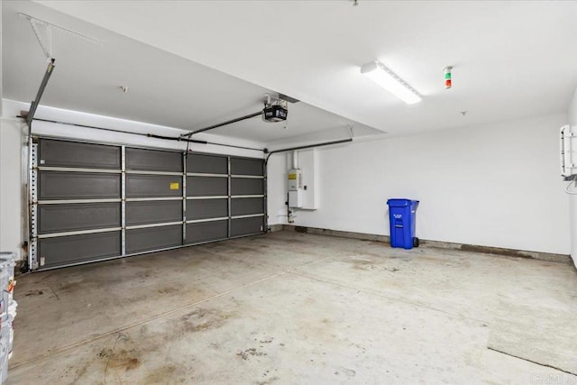 3023 Pacific Palm Way, San Diego, CA 92117 - garage featuring a garage door opener, gas water heater, and baseboards
