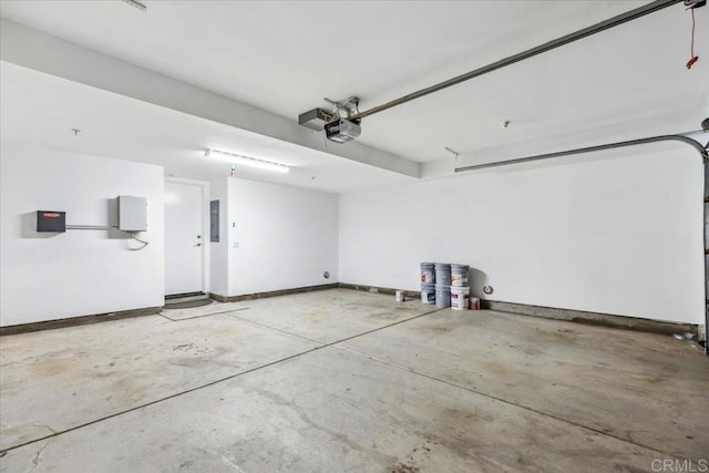 3023 Pacific Palm Way, San Diego, CA 92117 - garage with a garage door opener, electric panel, and baseboards