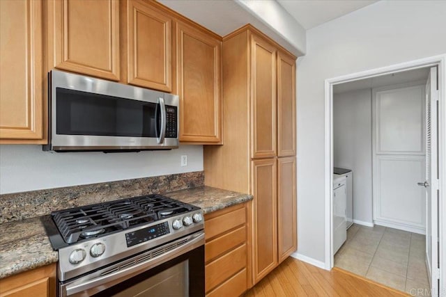 3023 Pacific Palm Way, San Diego, CA 92117 - kitchen featuring stainless steel appliances and dark stone counters
