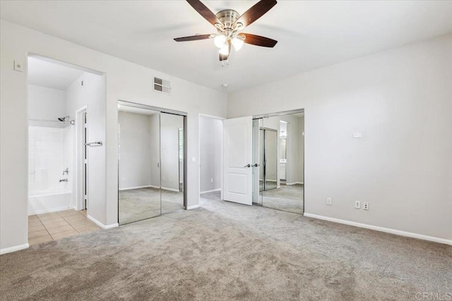 3023 Pacific Palm Way, San Diego, CA 92117 - unfurnished bedroom with carpet flooring, two closets, ensuite bathroom, and baseboards